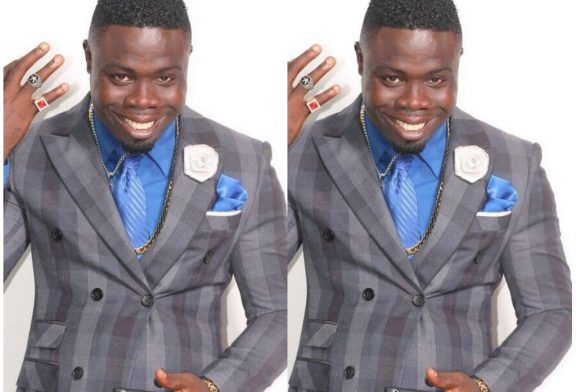 Pastor Blinks in police grips