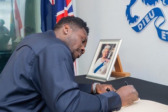 Photos of Asamoah Gyan signing a book of condolence for Queen Elizabeth II